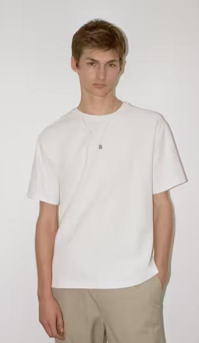 A man wearing FRAME jacquard relaxed tee in off white