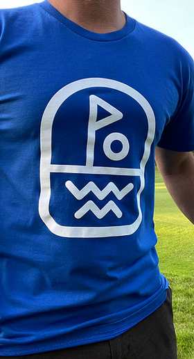 A man wearing Clinch Golf blue clinch 'flagstick' ss tee