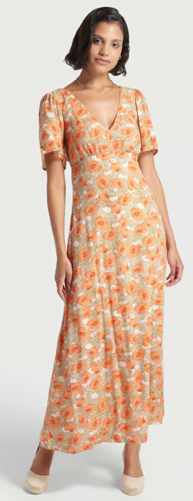 A woman wearing Modcloth floral meadow whisper maxi dress