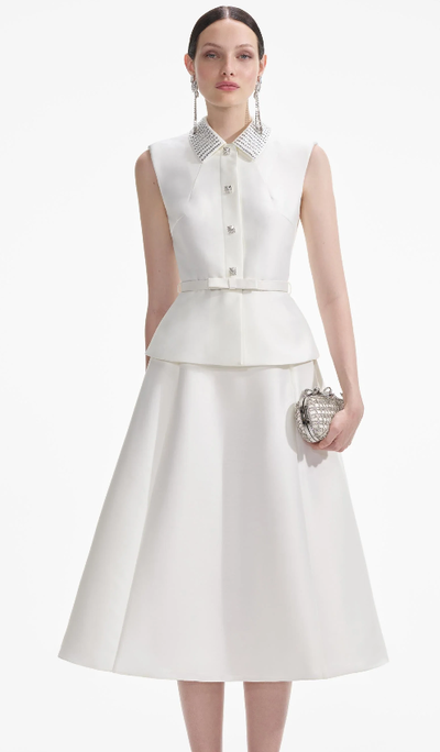 A woman wearing Self-Portrait cream taffeta diamante midi dress