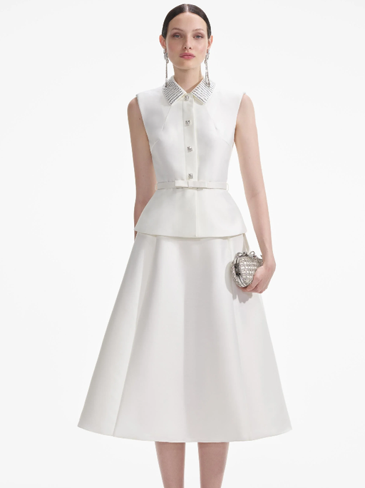 A woman wearing Self-Portrait cream taffeta diamante midi dress