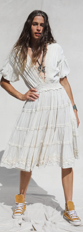 A woman wearing Jen's Pirate Booty white revelry dress