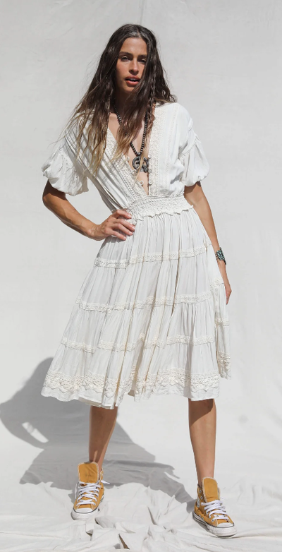 A woman wearing Jen's Pirate Booty white revelry dress