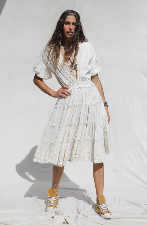 A woman wearing Jen's Pirate Booty white revelry dress
