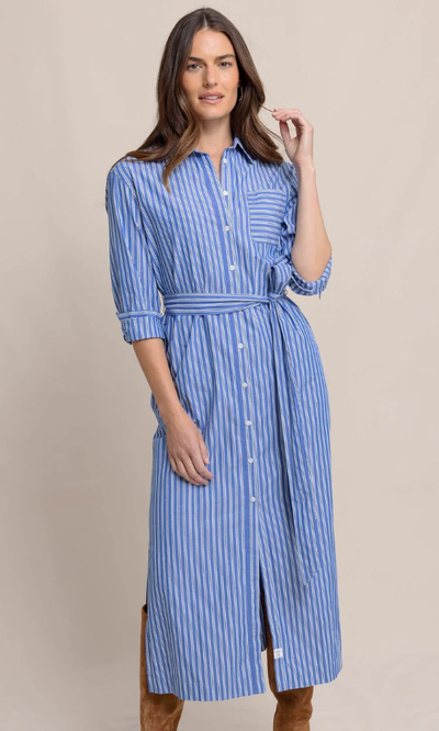 A woman wearing Southern Tide blue lolite farren striped shirt dress