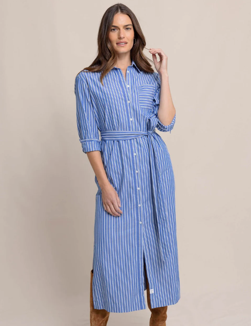 A woman wearing Southern Tide blue lolite farren striped shirt dress