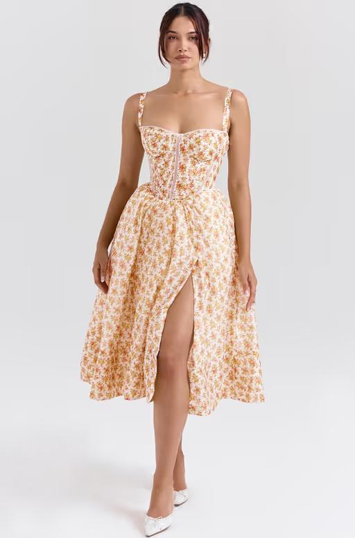 A woman wearing House of CB royal rose print corset midi sundress