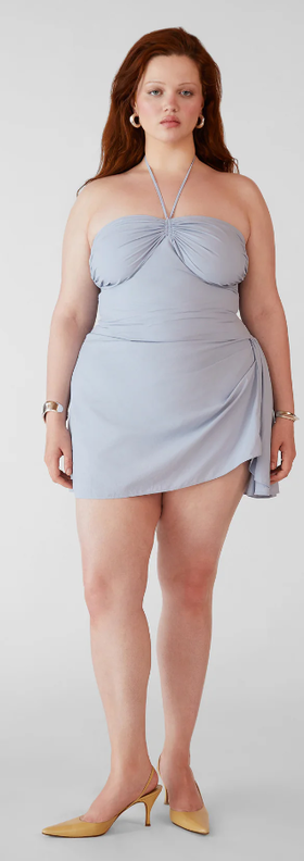 A woman wearing Orseund Iris bardot mini dress - parisian blue