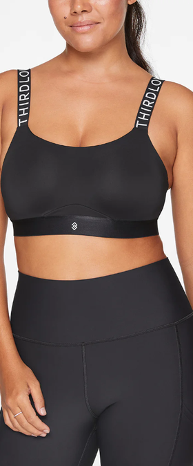 A woman wearing ThirdLove adjustable sports bra - black