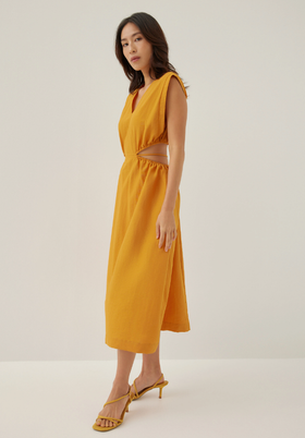 A woman wearing love bonito butternut color harleen elastic fit & flare midi dress