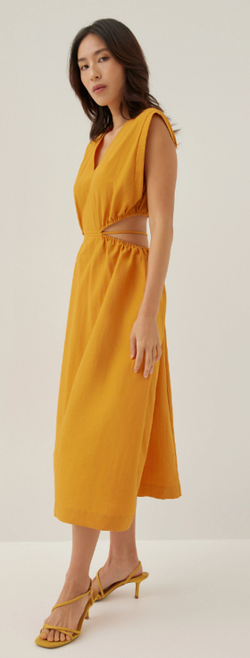 A woman wearing love bonito butternut color harleen elastic fit & flare midi dress