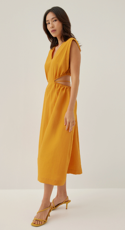 A woman wearing love bonito butternut color harleen elastic fit & flare midi dress