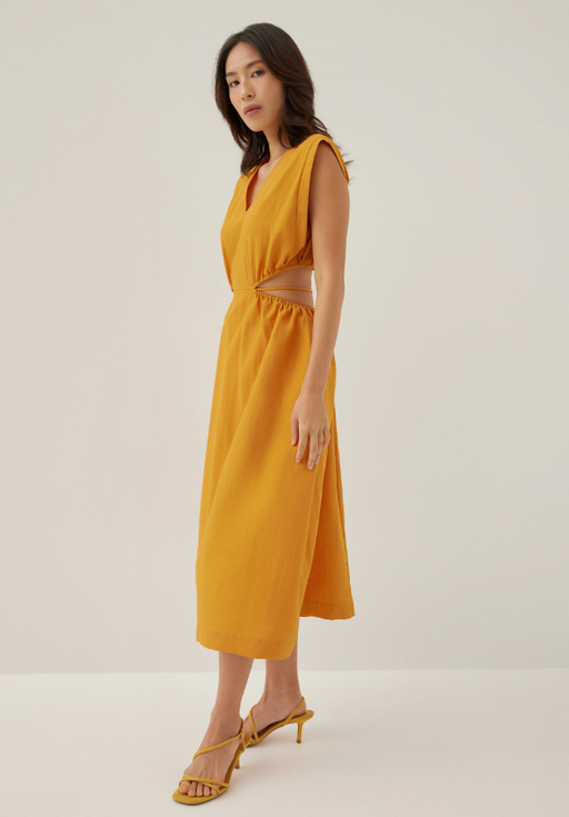 A woman wearing love bonito butternut color harleen elastic fit & flare midi dress