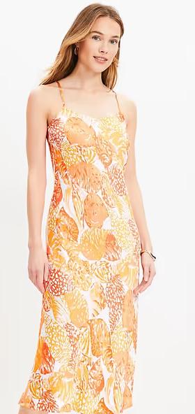 A woman wearing Loft baked gold shell bias midi slip dress