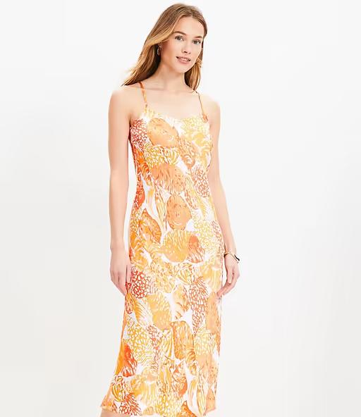 A woman wearing Loft baked gold shell bias midi slip dress