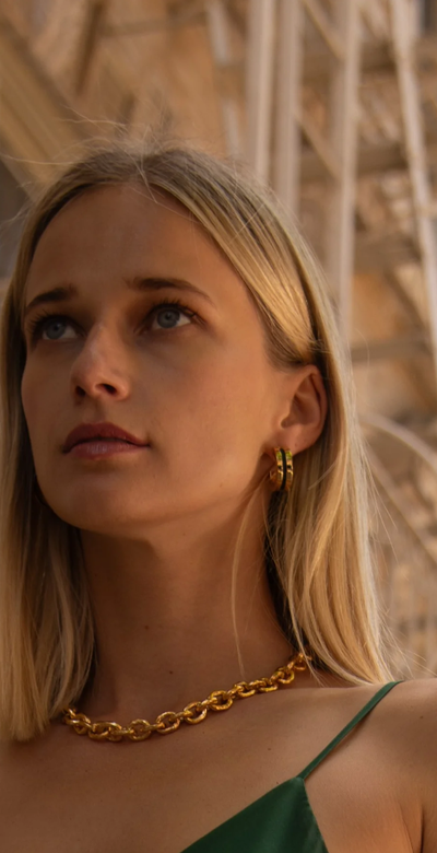 A woman wearing Soko anga inlay hoop earrings