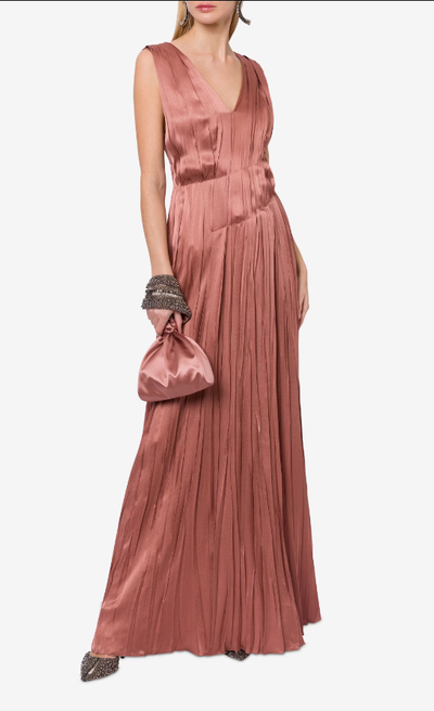 A woman wearing Alberta Ferretti powder pink satin long dress with pleats