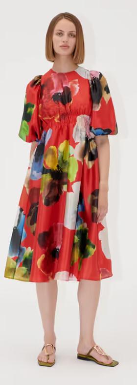 A woman wearing Stine Goya elasticated waist midi dress - bloom in red