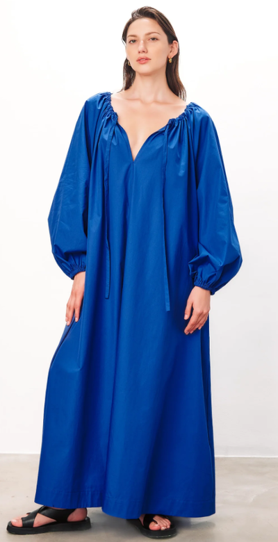 A woman wearing Mara Hoffman blue color salma dress