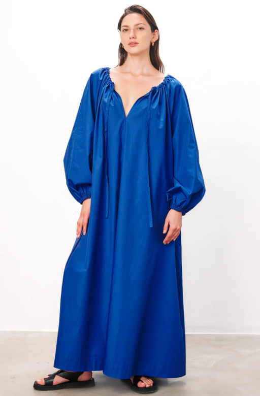 A woman wearing Mara Hoffman blue color salma dress