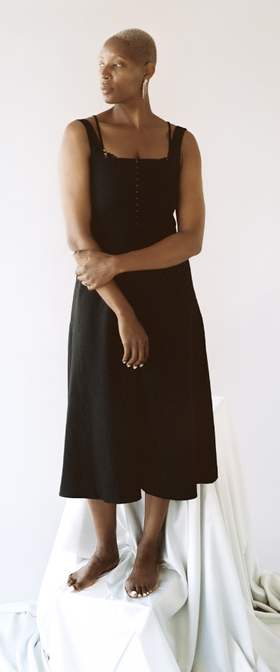 A woman wearing Lonely Lingerie venus hook and eye dress black