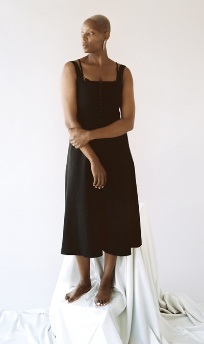 A woman wearing Lonely Lingerie venus hook and eye dress black