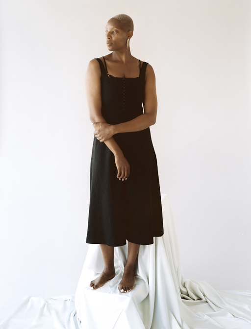 A woman wearing Lonely Lingerie venus hook and eye dress black