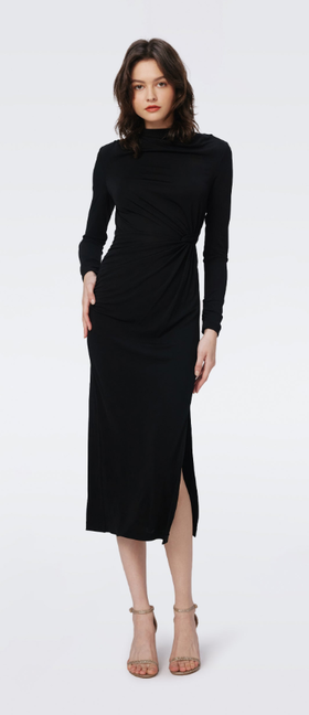 A woman wearing DVF black sonja dress