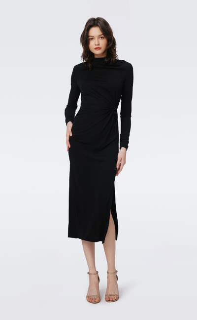 A woman wearing DVF black sonja dress