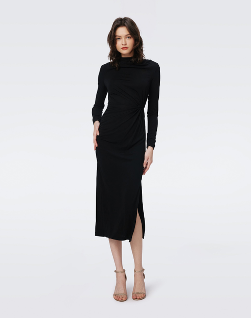 A woman wearing DVF black sonja dress