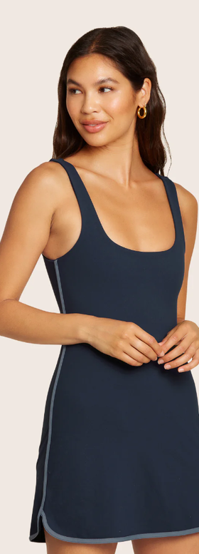 A woman wearing Set Active harbor color stripe dress