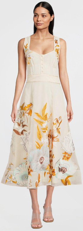 A woman wearing karen millen cream color botanical embroidery organdie strappy midi dress