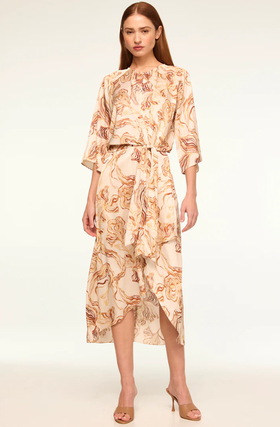 A woman wearing Misa Los Angeles straw satin adina dress