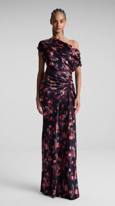 A woman wearing A.L.C. navy multi poppy stretch silk gown