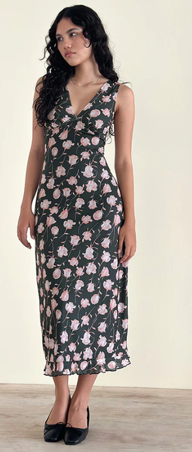 A woman wearing Motel Rocks gabriela midi dress in falling rose jet black