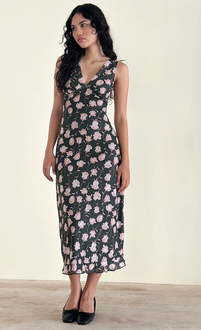 A woman wearing Motel Rocks gabriela midi dress in falling rose jet black