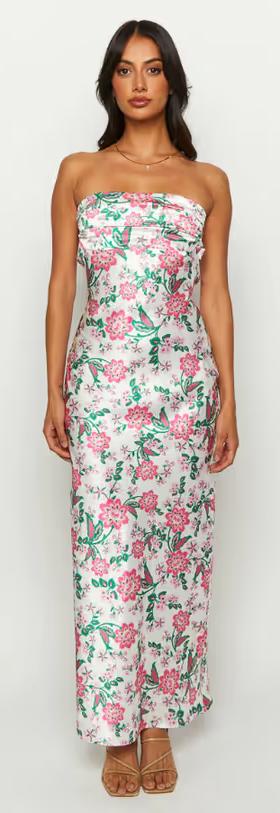 A woman wearing Beginning Boutique astra strapless floral satin midi dress
