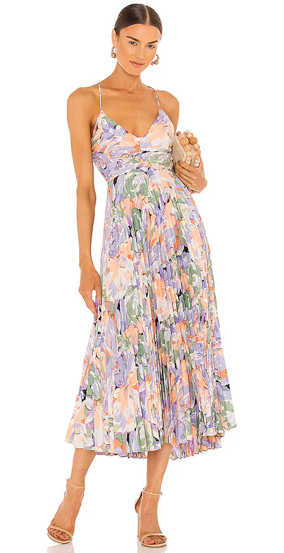 A woman wearing Lovers + Friends coral multi color blythe dress