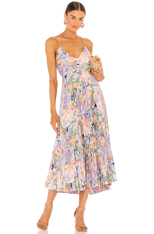 A woman wearing Lovers + Friends coral multi color blythe dress