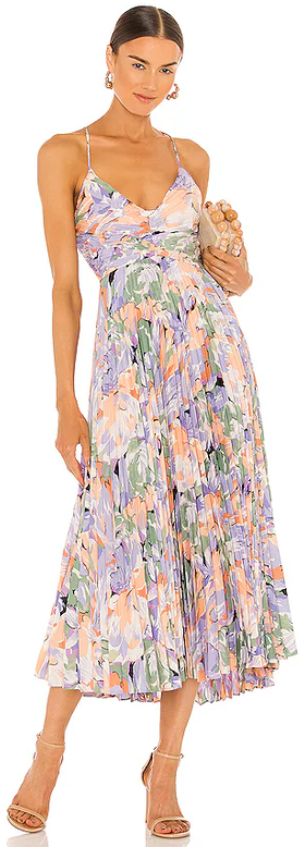 A woman wearing Lovers + Friends coral multi color blythe dress