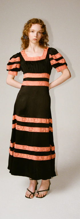 A woman wearing Shrimps cressida dress - black/melon