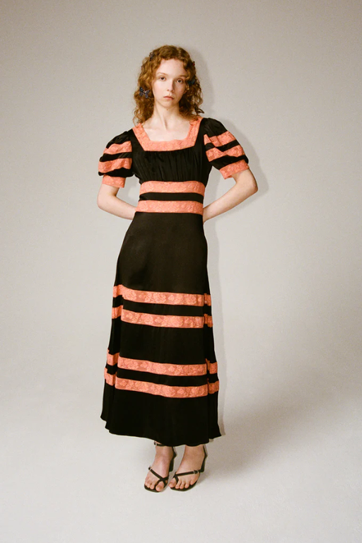 A woman wearing Shrimps cressida dress - black/melon
