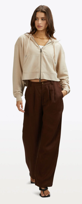 A woman wearing cuts clothing birch color cloud-fleece© zip-hoodie