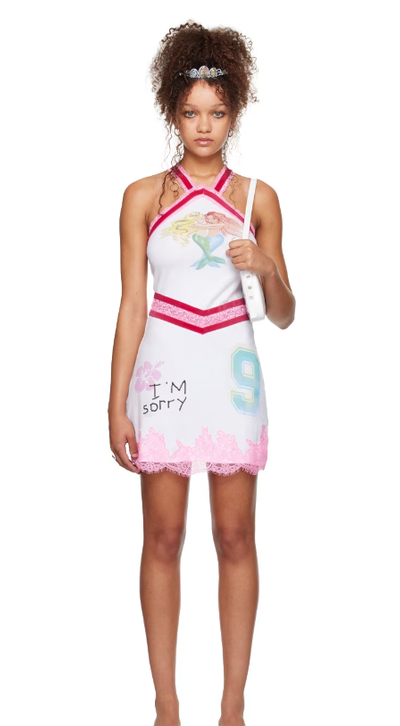 A woman wearing I’m Sorry by Petra Collins ssense exclusive white mimi wade edition kitty minky minidress