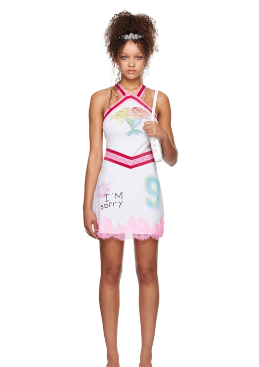 A woman wearing I’m Sorry by Petra Collins ssense exclusive white mimi wade edition kitty minky minidress
