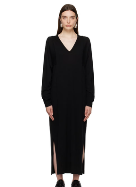 A woman wearing House of Dagmar black paneled maxi dress