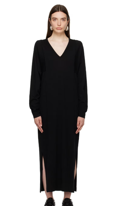 A woman wearing House of Dagmar black paneled maxi dress