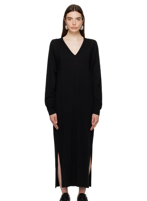 A woman wearing House of Dagmar black paneled maxi dress