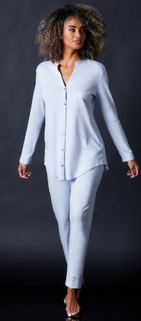 A woman wearing Journelle blue long sleeve pajama