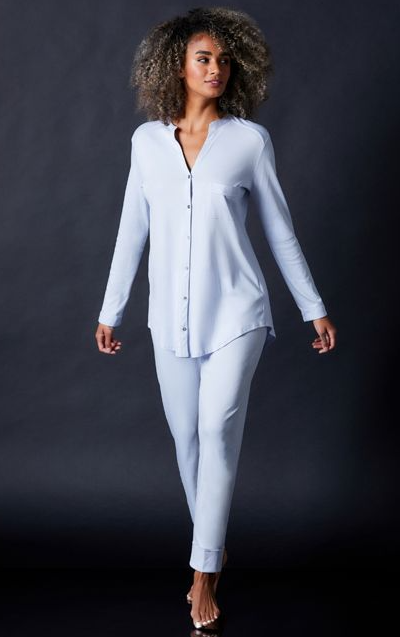 A woman wearing Journelle blue long sleeve pajama